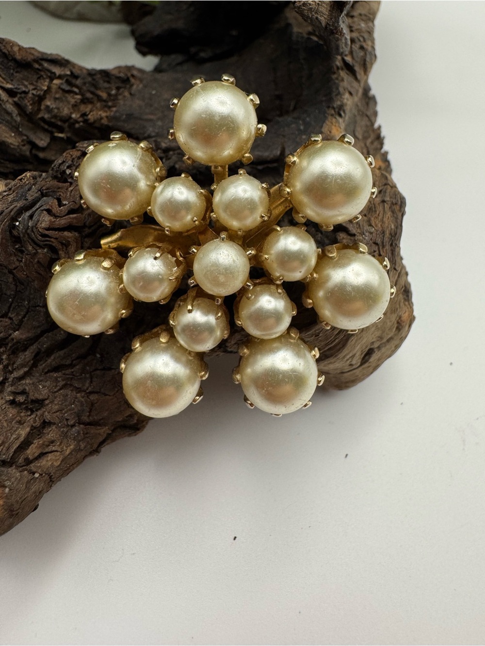 Vintage faux pearl brooch, EUC. Prong set and riveted backs in gold tone metal.